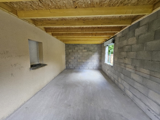 Charpente bois posée sur extension maçonnée – Vue intérieure à La Chapelle-du-Lou-du-Lac (35)